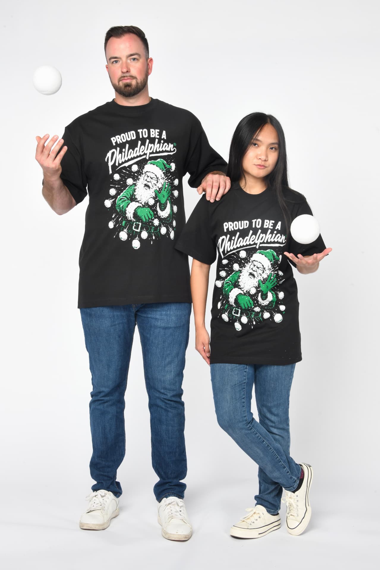 Models wearing Philly Santa tees with snowballs